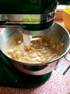 Stirring in ingredients with stand mixer.