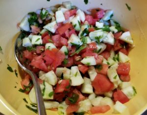 Armenian chopped salad of tomatoes, cucumbers, bell pepper, parsley and mint