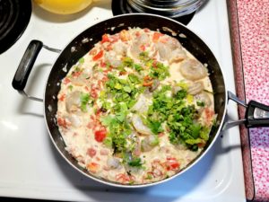 Add shrimp, lime juice, salt and cilantro.