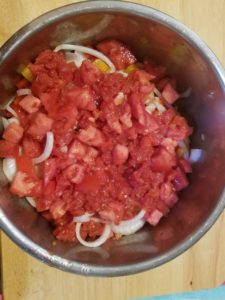 Top layer of onion, bell pepper, and tomatoes