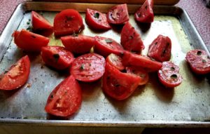 Cut tomatoes on pan