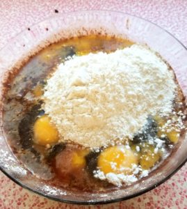 Adding in eggs, vanilla, salt and flour for brownies