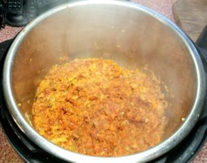 Stir in tomato paste, salt, pepper. thyme, oregano and nutmeg.