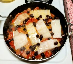 Add fish filets and Kalamata Olives.